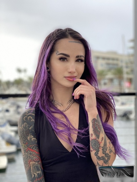 Purple-haired American Valerica Steele blows a big dick & gives a POV rimjob (21 photos)