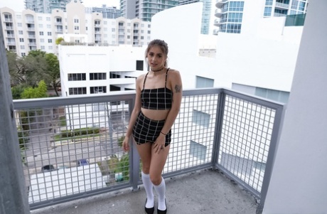 Pretty small titted Sofie Reyez peels her slutwear to pose nude on the balcony (16 photos)