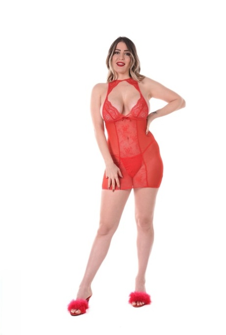 Curvy blonde Marica Chanelle discards red lingerie before toying her pussy (15 photos)