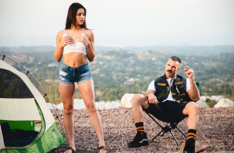 Kylie Rocket dons her man's colors after going nude while camping (20 photos)