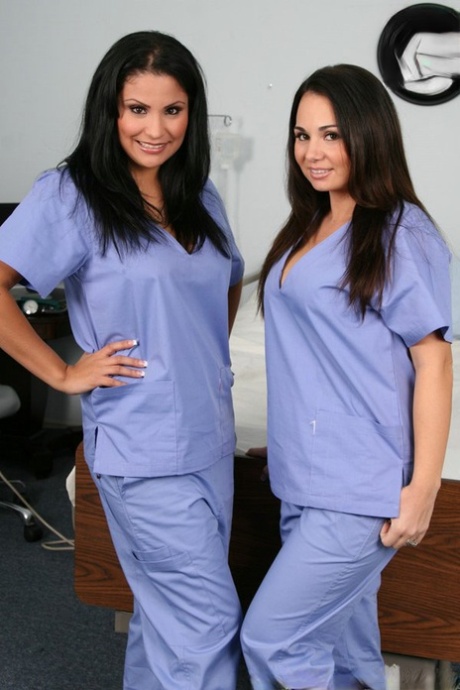 Lesbian nurses Sophia Lomeli & Holly West remove their scrubs while kissing (21 photos)