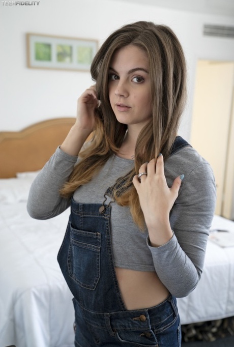 Adorable teen Devon Green pulls off her shorts to show sweet ass on the bed (19 photos)