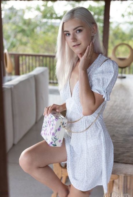 Platinum blonde teen Eva Elfie gets totally naked during a solo engagement (18 photos)
