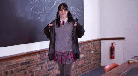 Brunette schoolgirl Charlie Elaine strips to thigh-high socks in a classroom (16 photos)